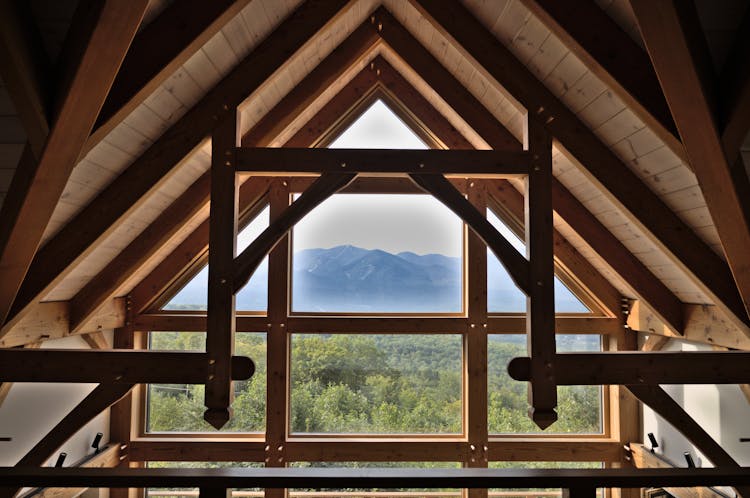 Wooden Trusses On Ceiling And Wooden Framed Glass Window