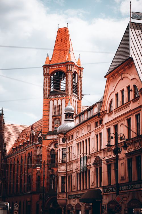 Free A picturesque view of historical architecture and a prominent tower in Bydgoszcz, Poland. Stock Photo
