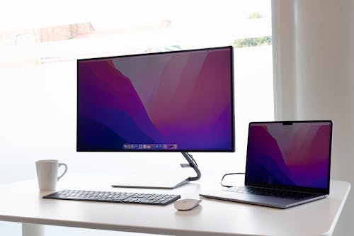 Free Computer and Laptop on the Table  Stock Photo