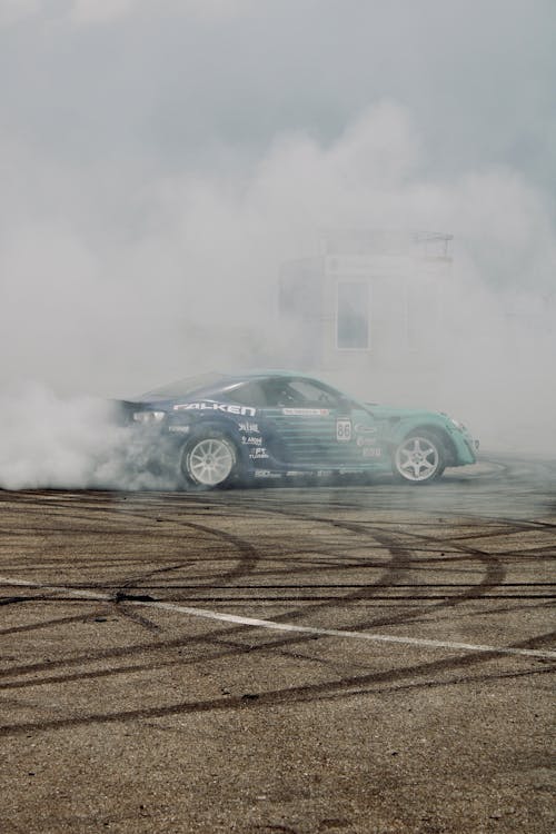 Tire Tracks and a Smoke Covered Race Car