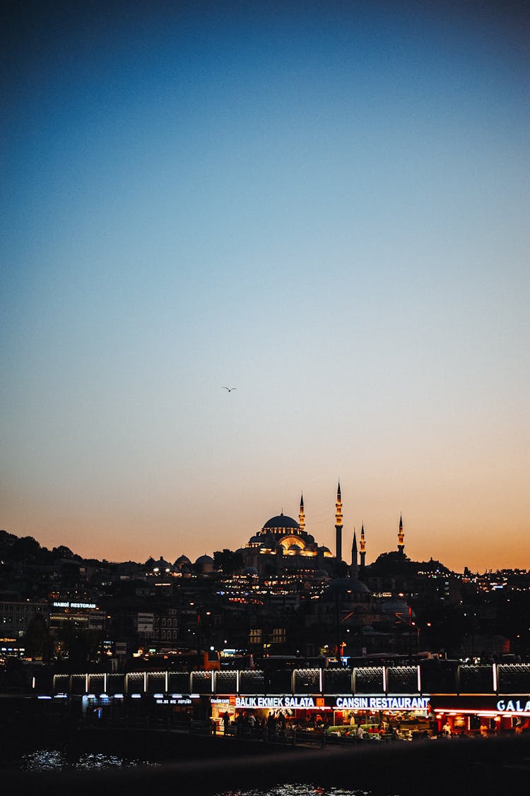 Silhouette Of City Buildings And Blue Mosque During Sunset