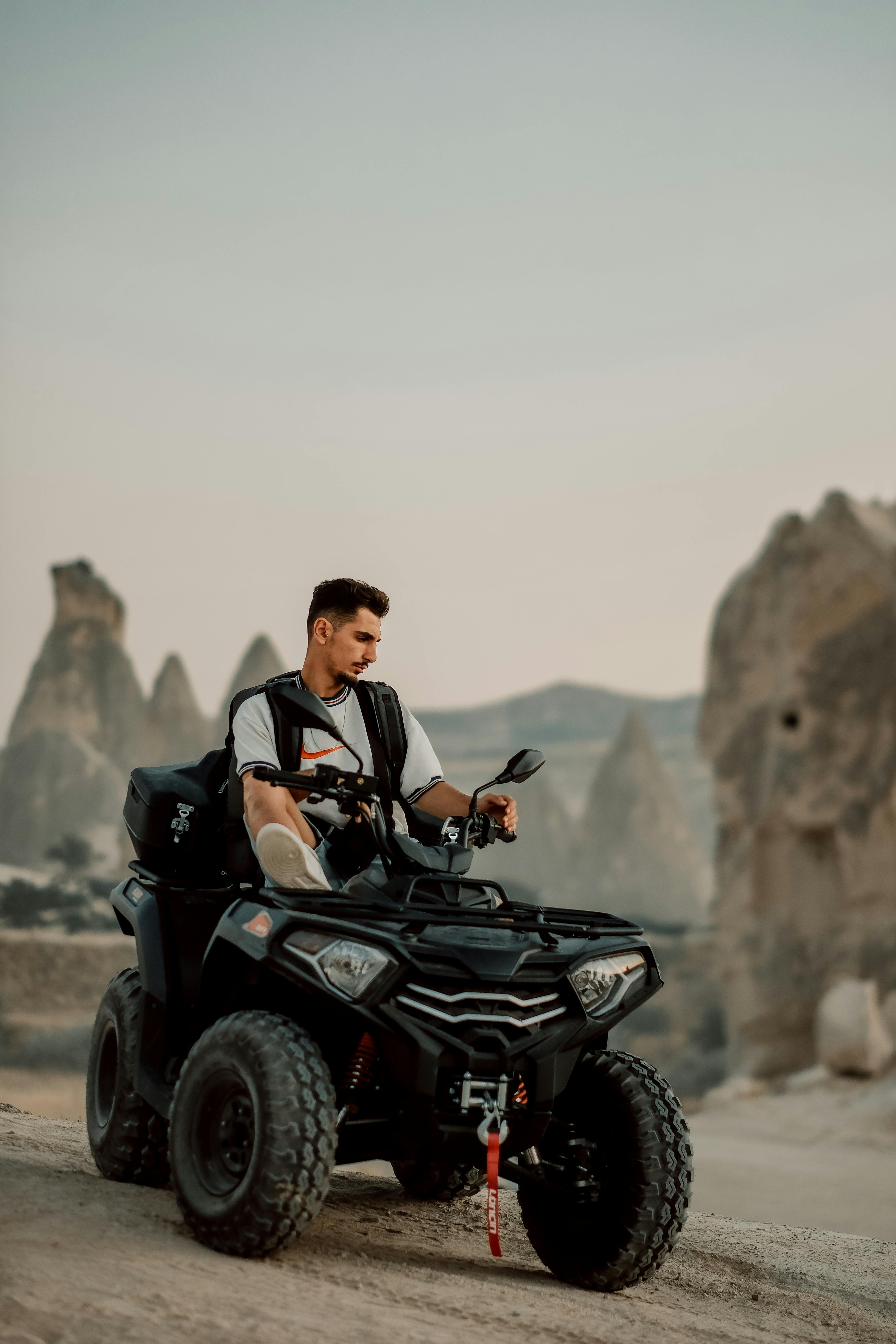 man driving atv vehicle