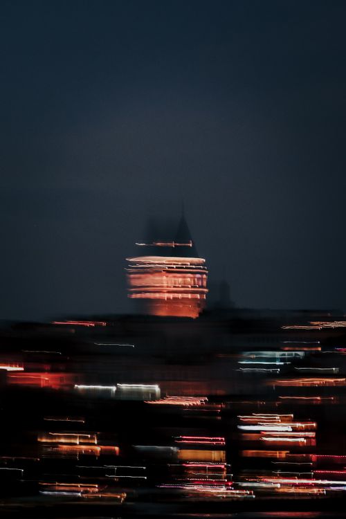 Free Blurred night view of the illuminated Galata Tower and city skyline, Istanbul, Turkey. Stock Photo