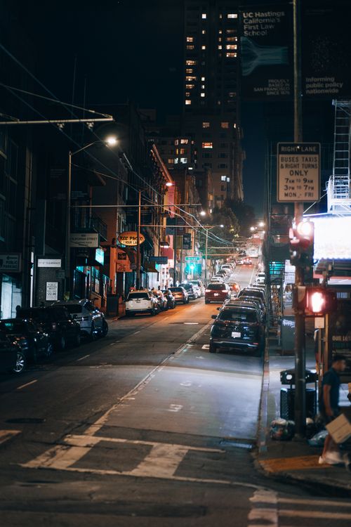 Free A bustling San Francisco street scene at night, showcasing urban life and city lights. Stock Photo