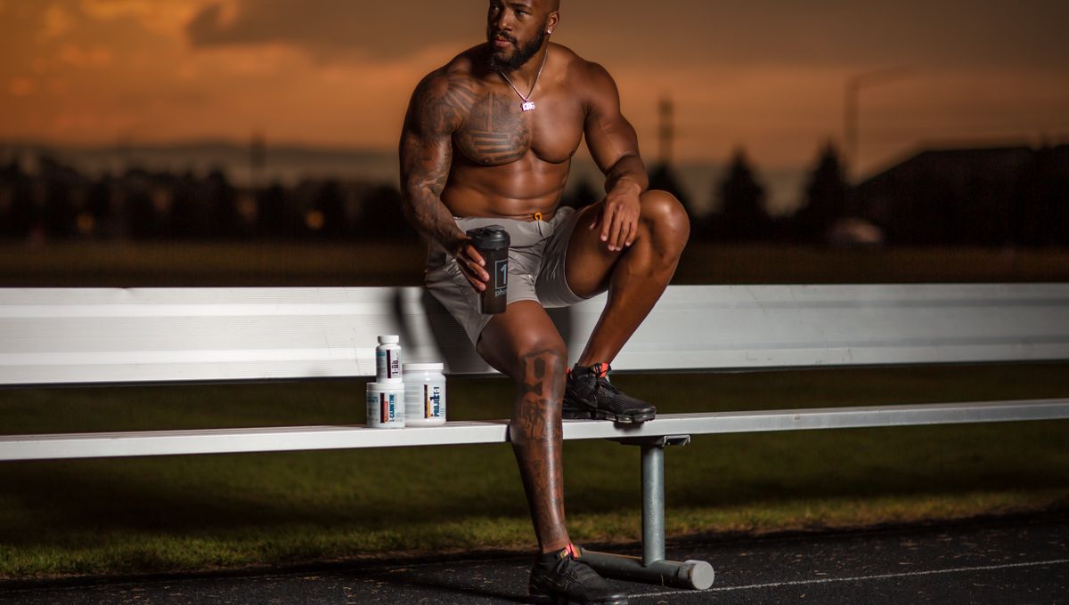 Athletic man with fitness gear on a bench