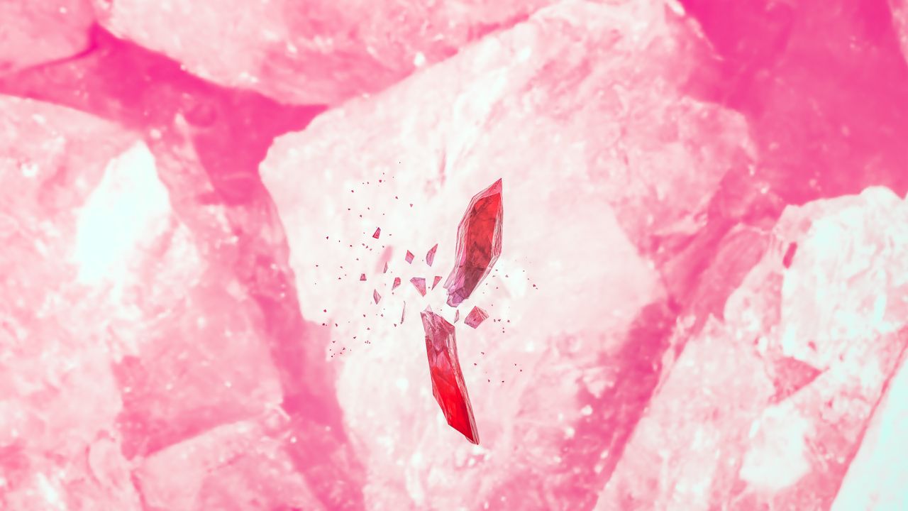 an abstract composition of shattered red gems on a vivid pink backdrop