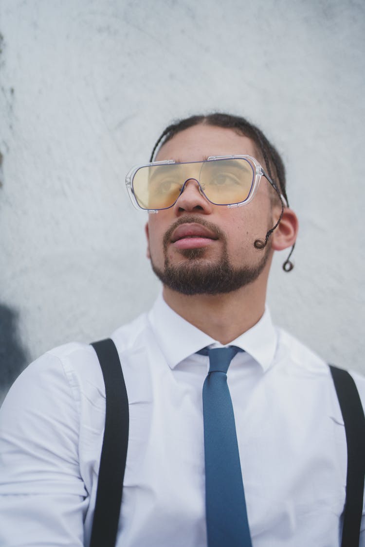 Elegant Man In Shirt And Tie Wearing Yellow Sunglasses