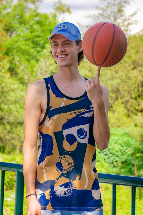 Young Man Playing with a Basketball 