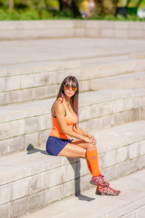 Sitting on Steps Woman Wearing Sportswear