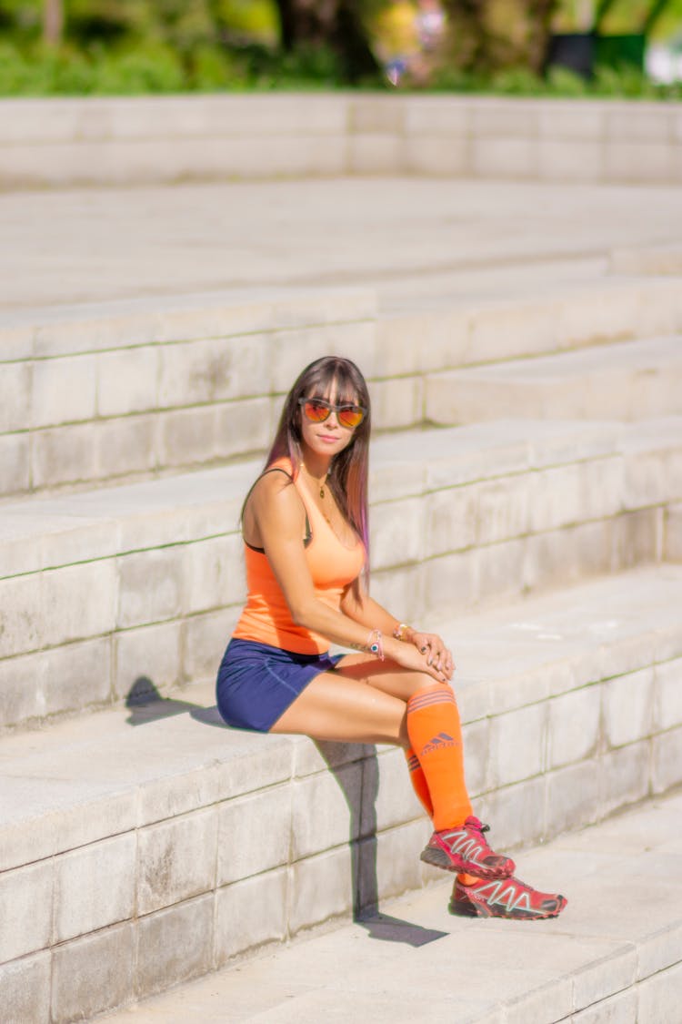 Sitting On Steps Woman Wearing Sportswear