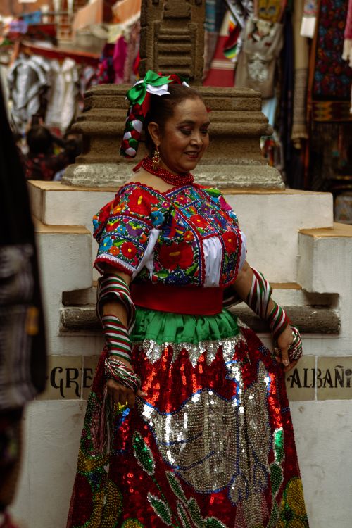 Free A woman in colorful traditional Mexican attire at a festival in Puebla, Mexico. Stock Photo