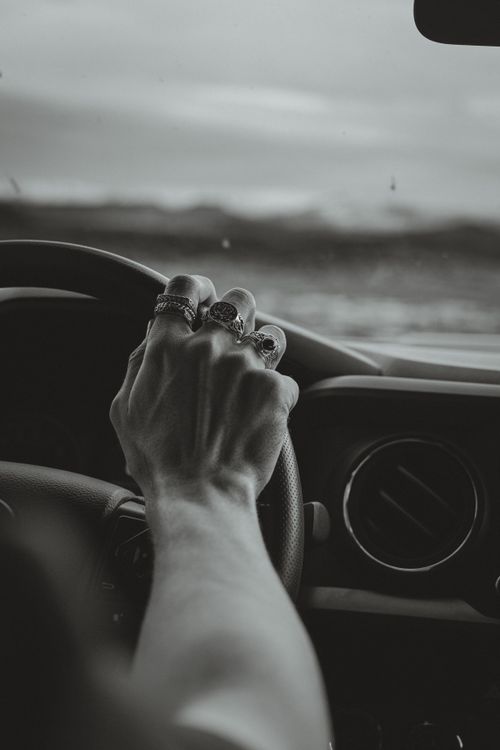 Grayscale Photo of Person Driving Car Wearing Three Rings · Free Stock ...