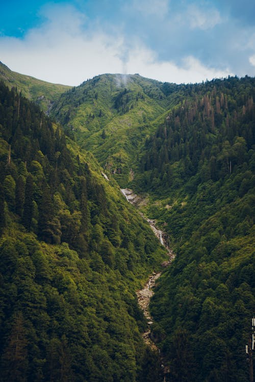 Green Mountains Under Blue Sky and White Clouds