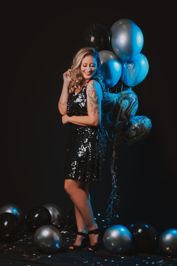 Woman in black sequin party dress