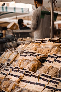 Diverse selection of Italian pasta on display at a bustling street market.