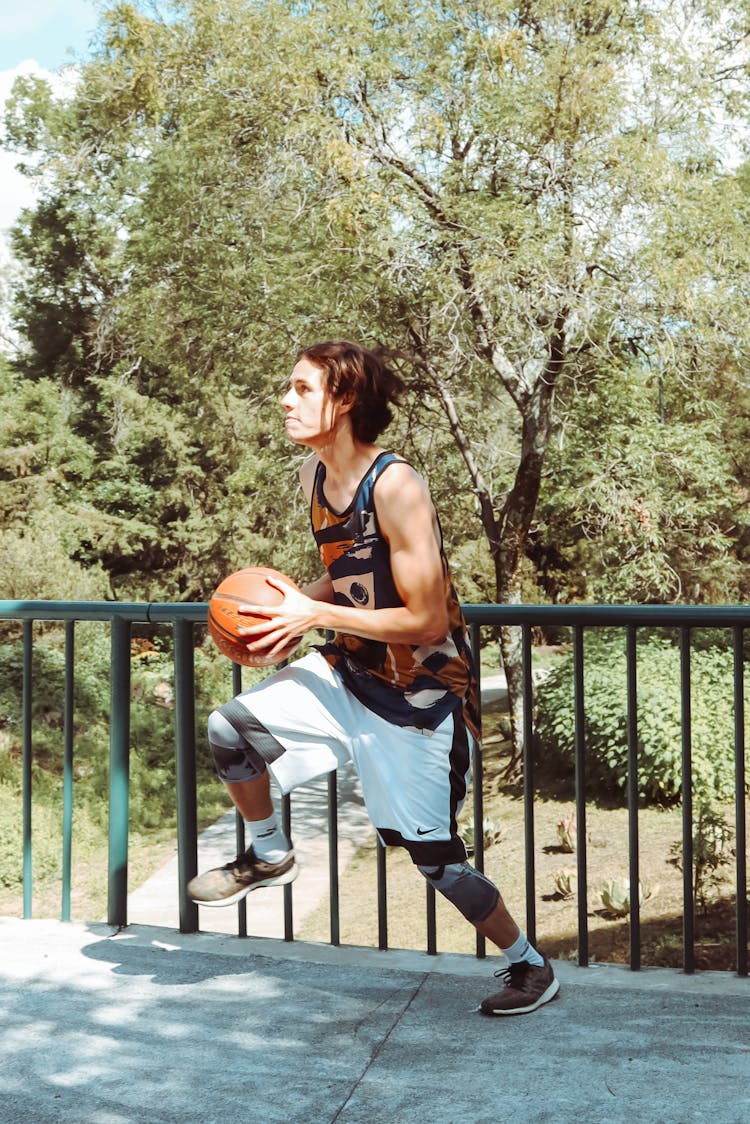 A Man Playing Basketball