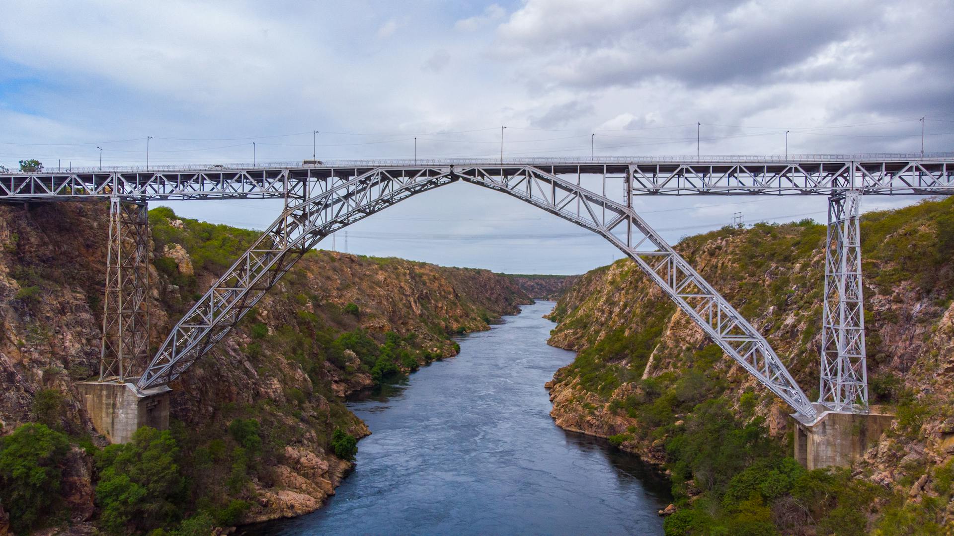 Explore Ponte Dom Pedro II arch bridge over the scenic Paulo Afonso canyon in Brazil.