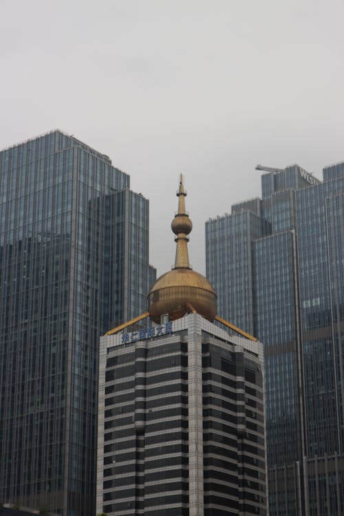 View of Modern Skyscrapers under a Cloudy Sky 