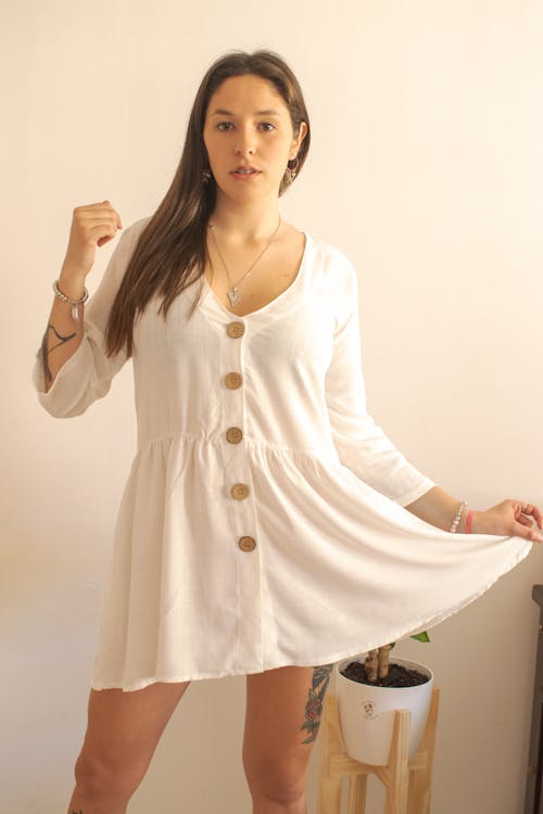Woman in White Long Sleeve Dress