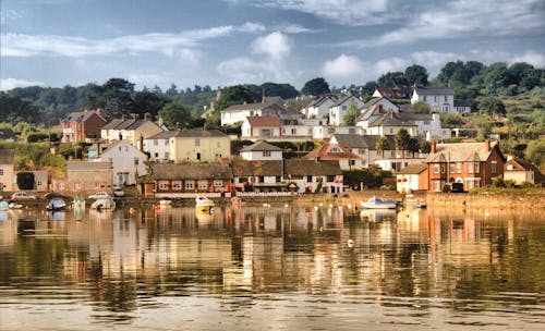 Free Houses Beside Body of Water Stock Photo