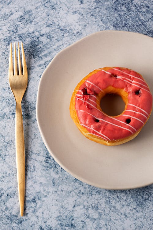 A Plate with Strawberry beside Gold Form 