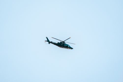 Free A helicopter flying against a clear blue sky in Ciudad de México, offering a dynamic view of aerial transportation. Stock Photo