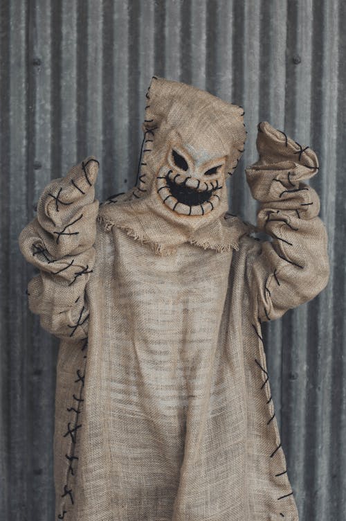 A Person Wearing Scary Costume Posing at the Camera