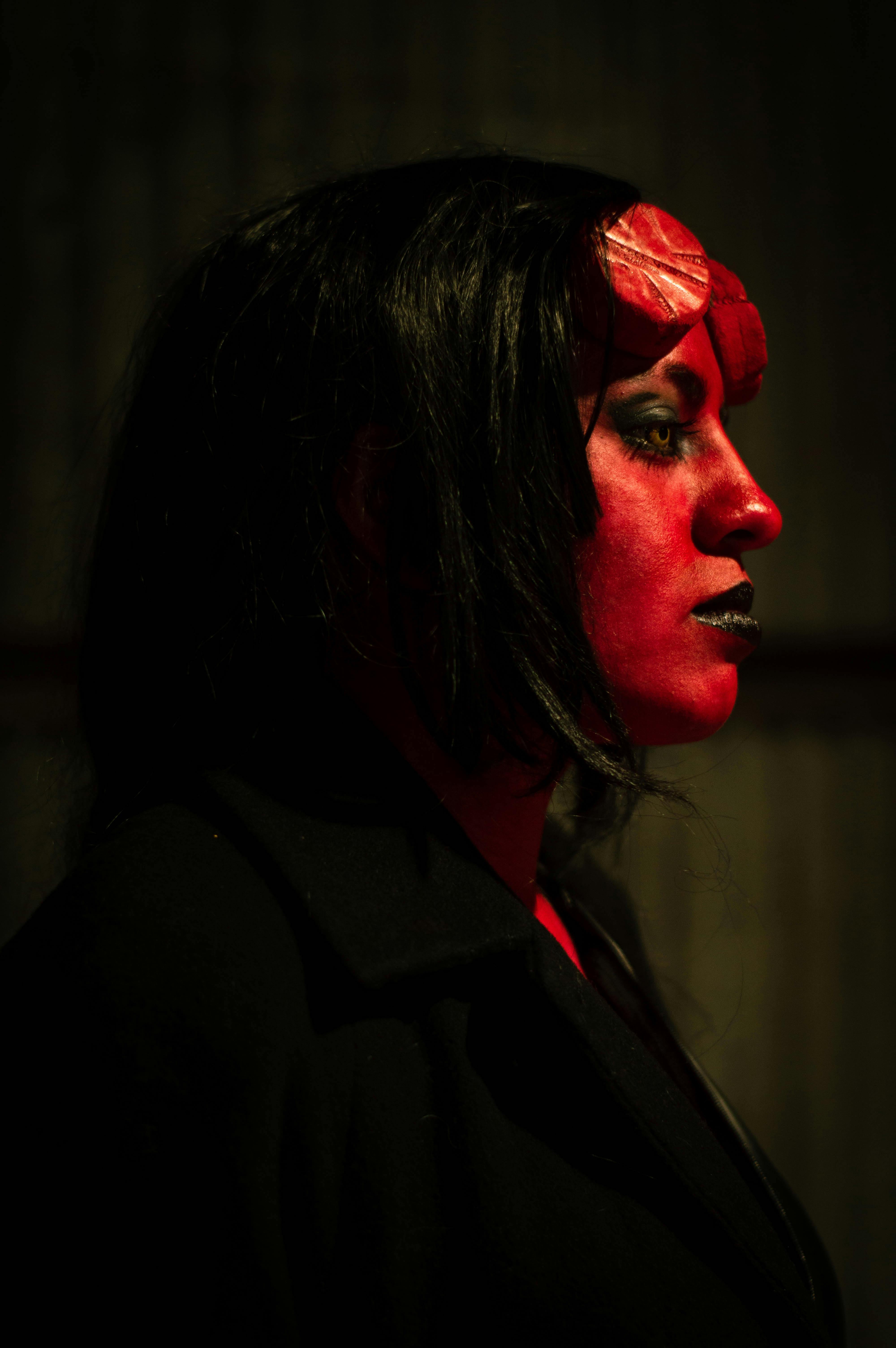 Free Dark and eerie portrait of a person in demon makeup, perfect for Halloween or horror themes. Stock Photo