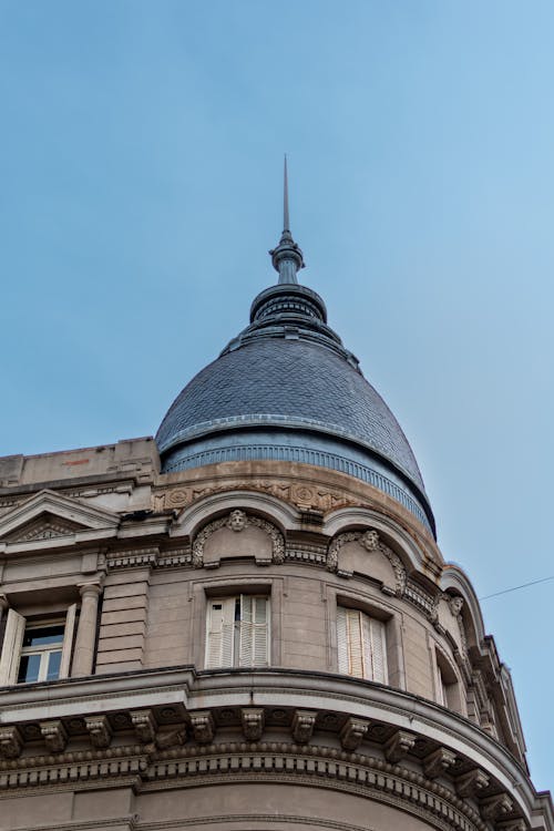 Gray Concrete Building Under the Blue Sky