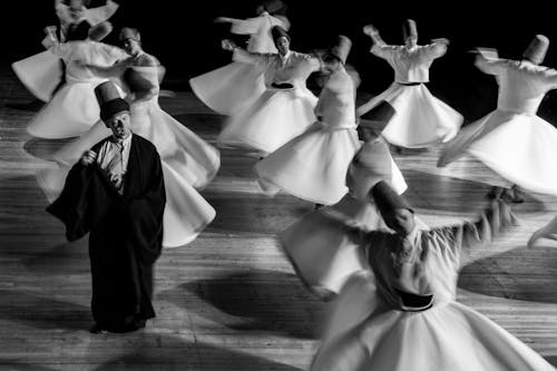 People Dancing During a Theatrical Performance 