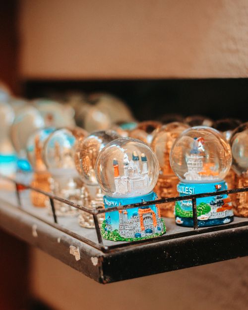 Free Colorful snow globes featuring Istanbul landmarks on a display shelf. Stock Photo