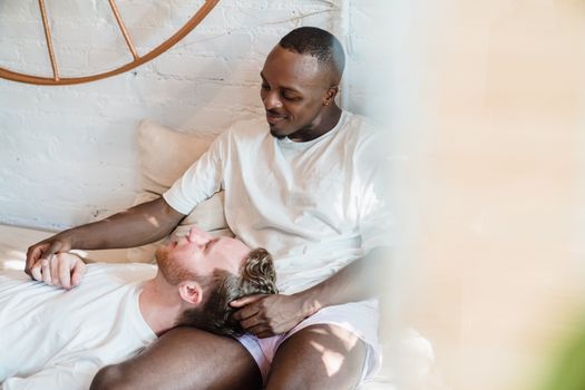 A joyful couple enjoying a peaceful morning together indoors, symbolizing love and togetherness.