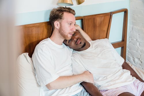 Free Gay Couple Hugging in Bed  Stock Photo