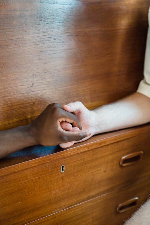 Close-up of Men Holding Hands 