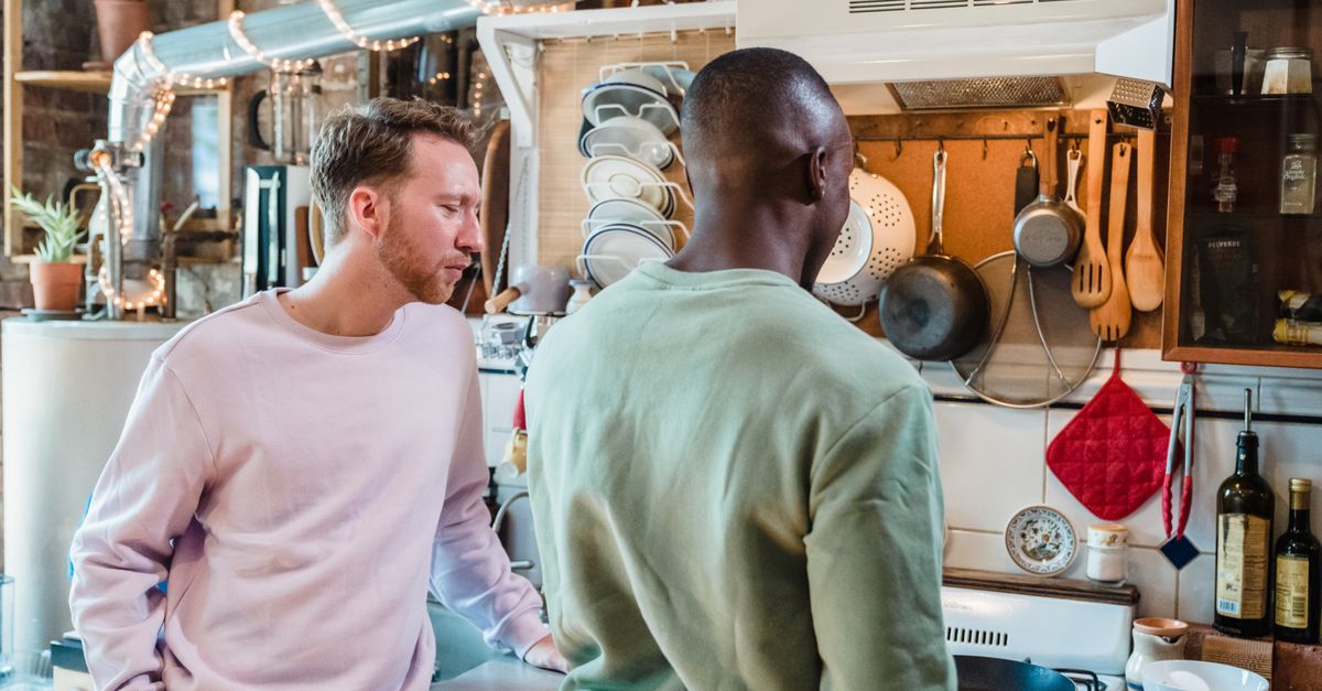Two Men Cookware Men Standing by a Stove in a Kitchen · Free Stock Photo