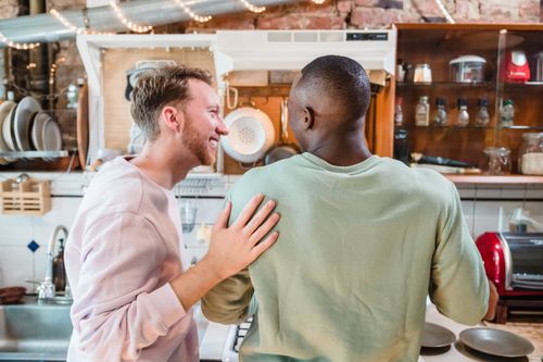 Free A happy couple shares a moment in a cozy kitchen setting, showcasing love and companionship. Stock Photo