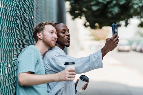 Couple Taking Selfie on City Street