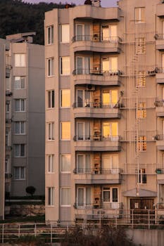 High-rise apartment building in Turkey at sunset with warm reflections.
