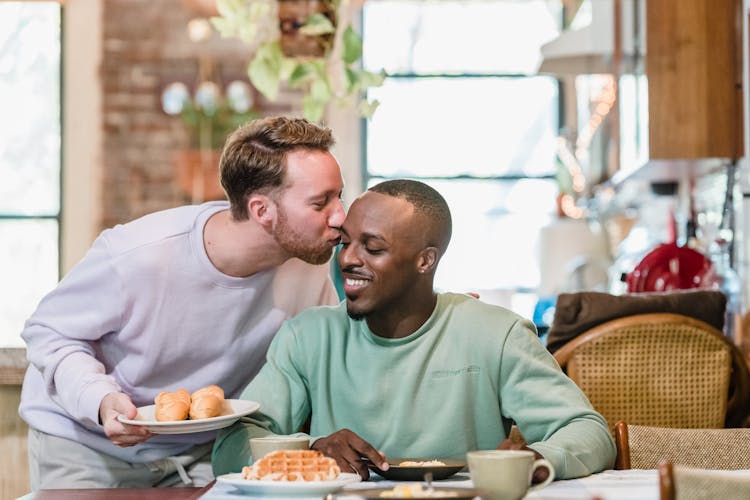 Happy Couple Enjoying Breakfast At Home