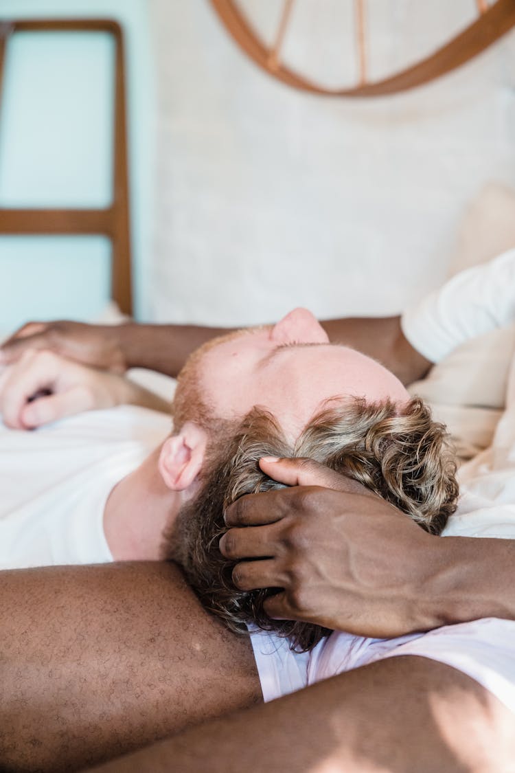 Close-up Of Couple Lying Together Hugging 