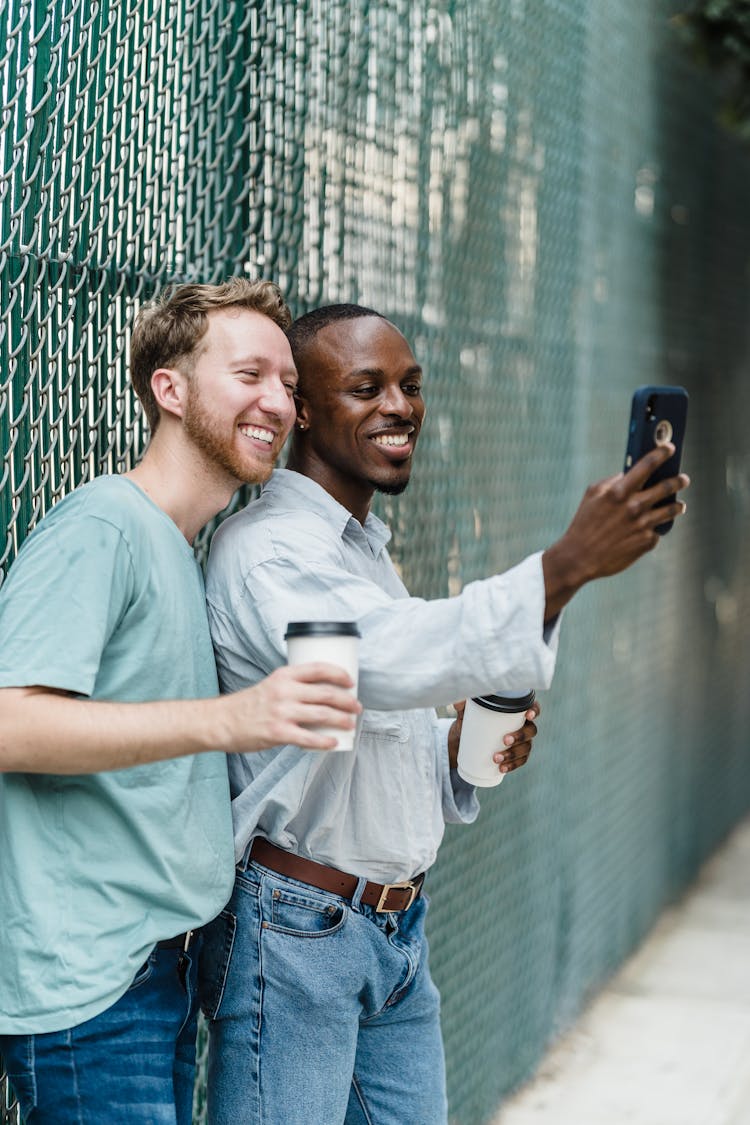 Gay Couple Taking A Selfie Outdoors