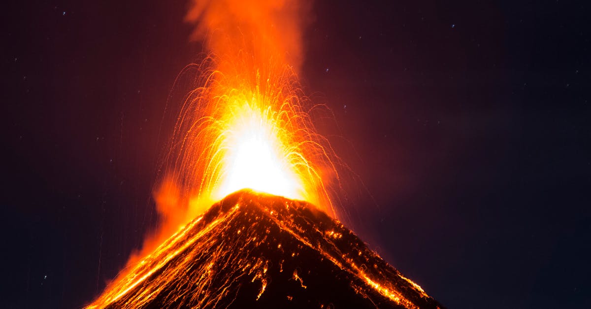 Spectacular night view of an active volcanic eruption at Fuego Volcano in Guatemala.