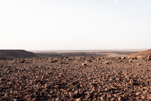 Expansive view of the rocky, arid terrain in Timokten, Adrar Province, Algeria.