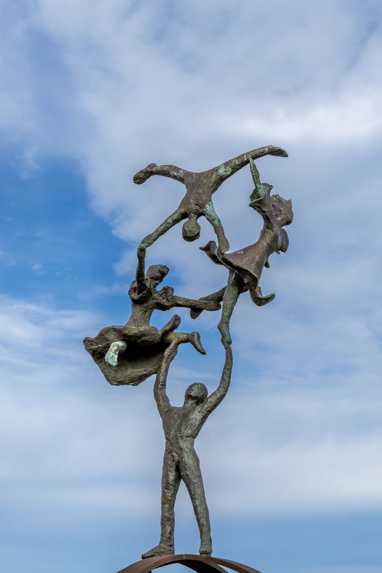Sculpture Of Children In Acrobatics