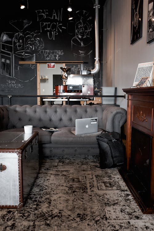 Gray Sofa by the Fireplace in a Stylish Cafe