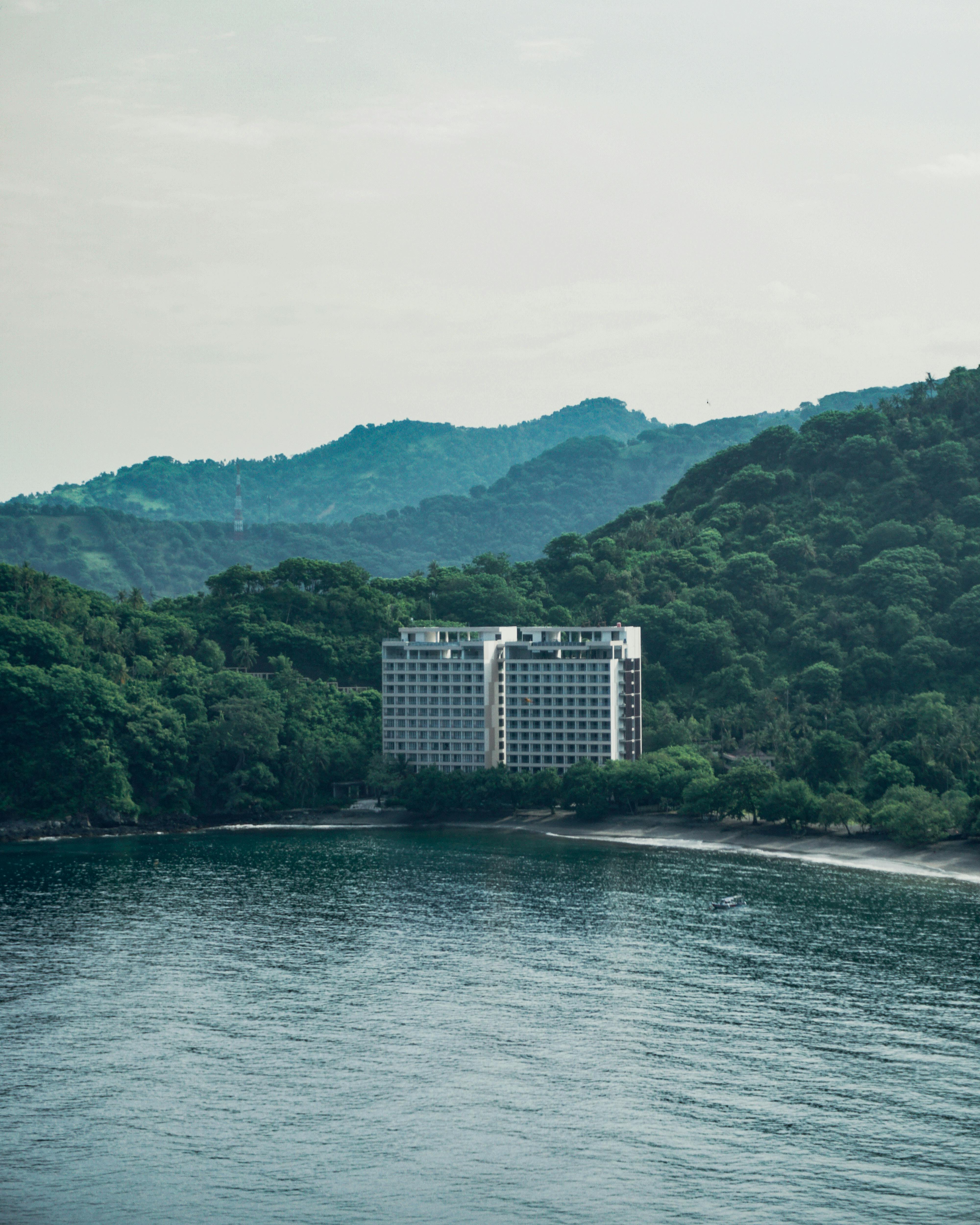 Free Aerial view of a Nusa Dua Hotels   surrounded by lush forests and sea in Lombok, Indonesia. Stock Photo