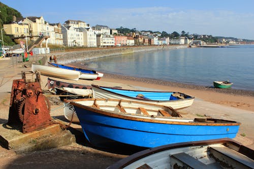 Row of Blue and White Dinghy Boats