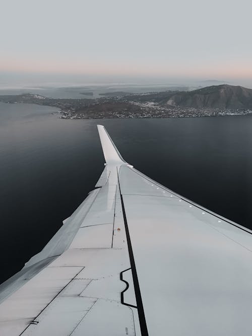 Airplane Wing Near Body of Water 