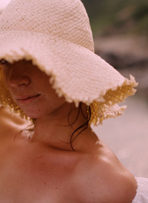 Woman Wearing a Straw Hat and Off-shoulder Dress 