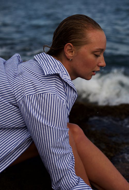 A Woman Sitting by a Sea